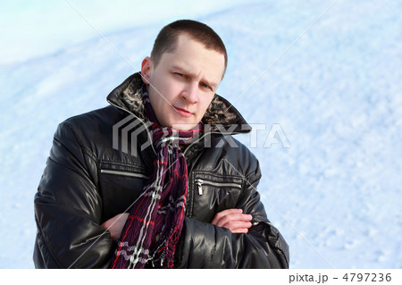 Student stands by winter day on snow and place arms on breast an Student stands by winter day on snow and place arms on breast an 4797236