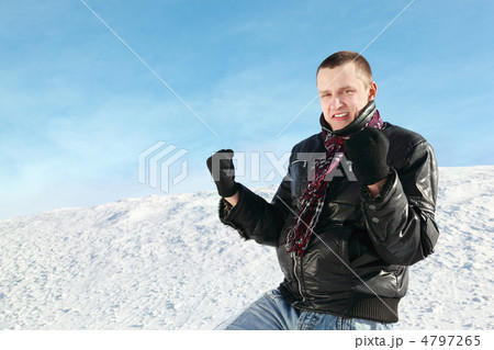 Student stands on snow in winter and clench hands in fists 4797265
