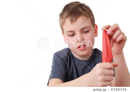 Boy hides  shawl in fist is focus 4799745