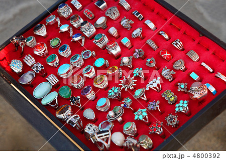 few rows of souvenir large rings on red backing. sale. wide rang 4800392