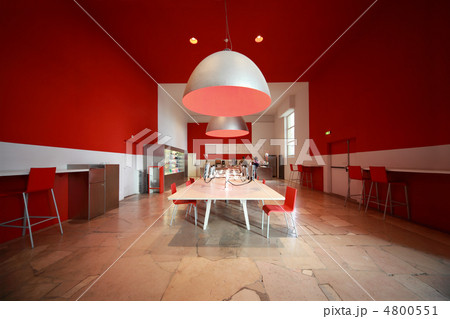 people in small cozy cafe. white tables, red chairs and walls people in small cozy cafe. white tables, red chairs and walls 4800551