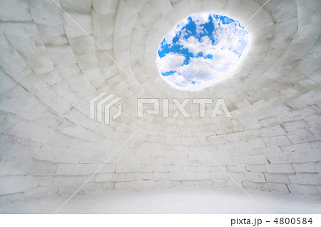 Inside empty house of ice, eskimo igloo, blue sky and clouds Inside empty house of ice, eskimo igloo, blue sky and clouds 4800584
