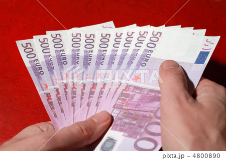 Close-up of many bundle of 500 Euro bank notes in man's hands, r Close-up of many bundle of 500 Euro bank notes in man's hands, r 4800890