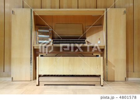 detail of wooden control panel of massive Pipe Organ; many keys 4801578