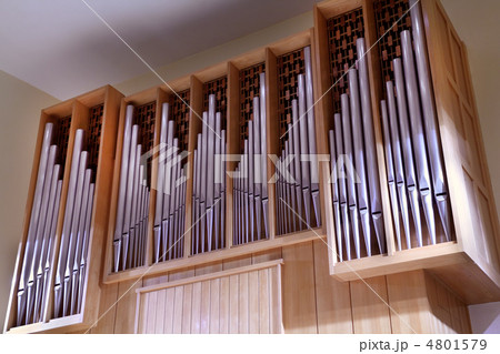 Detail look of large pipe organ; rows of beautiful metal pipes Detail look of large pipe organ; rows of beautiful metal pipes 4801579