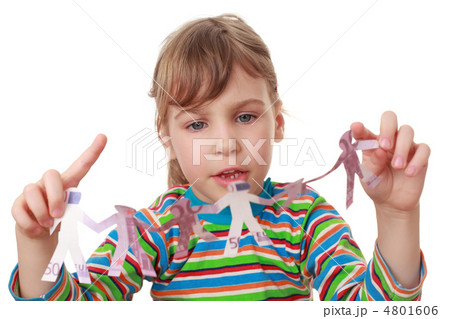 beautiful little girl in striped shirt play with garland of pape 4801606