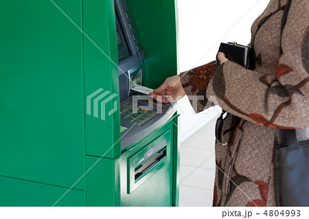 Girl uses bank terminal 4804993