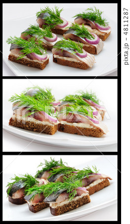 Sandwiches of rye bread with herring, onions and herbs. 4811287
