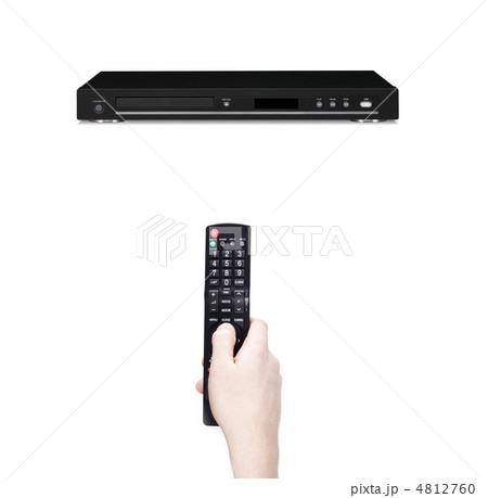 Remote control in the hand against dvd Remote control in the hand against dvd 4812760