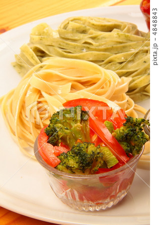 two italian tagliatelles and tomato with broccoli condiment two italian tagliatelles and tomato with broccoli condiment 4848843