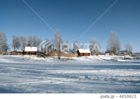 buildings in snow on coast river 4850623