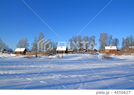 buildings in snow on coast river 4850627