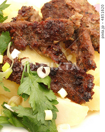Meat with a potato on a plate 4851620
