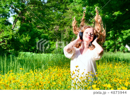beautiful girl in headphones enjoying the music with flowing hai 4873944