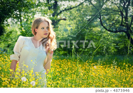 beautiful young girl in nature, in a field of flowers beautiful young girl in nature, in a field of flowers 4873946