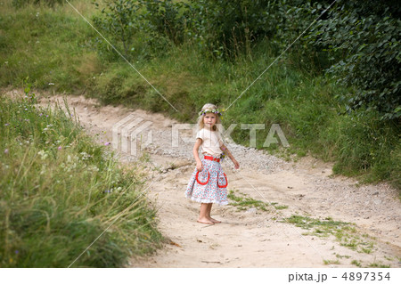 little girl standing on the road little girl standing on the road 4897354