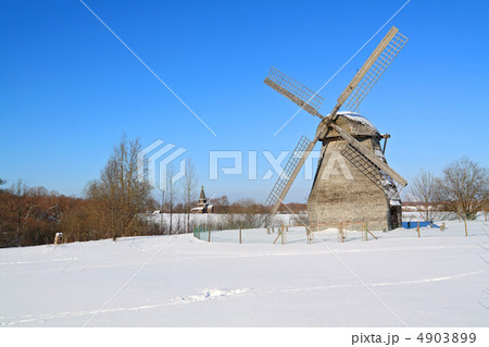 aging mill on snow field aging mill on snow field 4903899