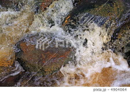 quick river flow amongst stone 4904064