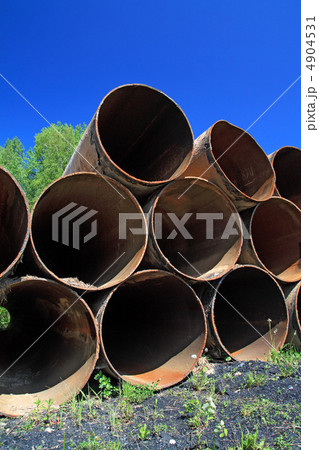 old gas pipes amongst green herb 4904531
