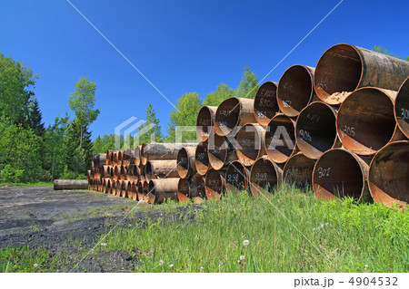 old gas pipes amongst green herb 4904532