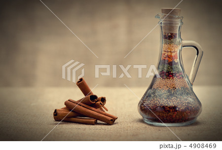 Bottle of spices and cinnamon 4908469