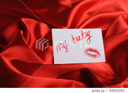 Note on red silk. With an inscription " My baby " and a print of Note on red silk. With an inscription " My baby " and a print of 4909282
