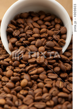 White cup with coffee grains White cup with coffee grains 4909603