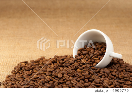 White cup with coffee grains White cup with coffee grains 4909779