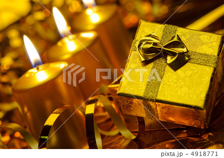 Gold christmas candles and gold gift boxes 4918771