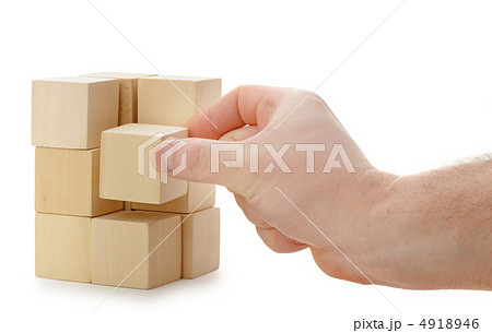 The hand establishes a wooden cube The hand establishes a wooden cube 4918946