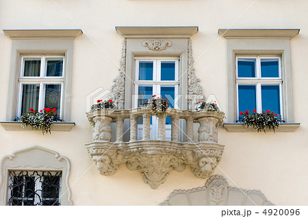 Facade of a building with a balcony and flowers 4920096