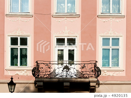 Facade of a building with a balcony. 4920135