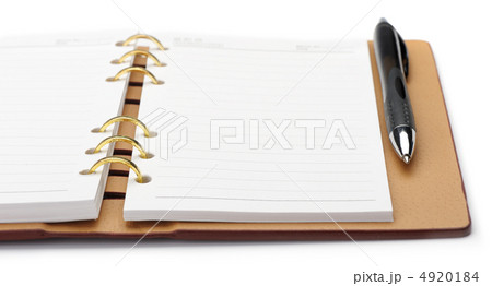 Open notebook with copper binding and stylish pen Open notebook with copper binding and stylish pen 4920184