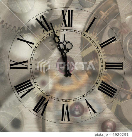 Old hours with figured arrows on mechanism blur background Old hours with figured arrows on mechanism blur background 4920291