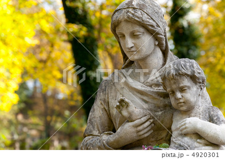 Monument of the woman with the child on a cemetery 4920301