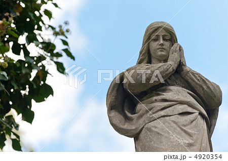 Monument Lady of Guadalupe on a cemetery Monument Lady of Guadalupe on a cemetery 4920354