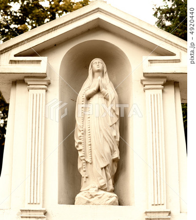 Monument Lady of Guadalupe on a cemetery 4920440