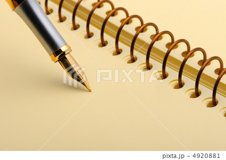 Fountain pen on a yellow notebook 4920881