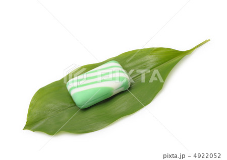 Soap on a green leaf of a lily of the valley Soap on a green leaf of a lily of the valley 4922052