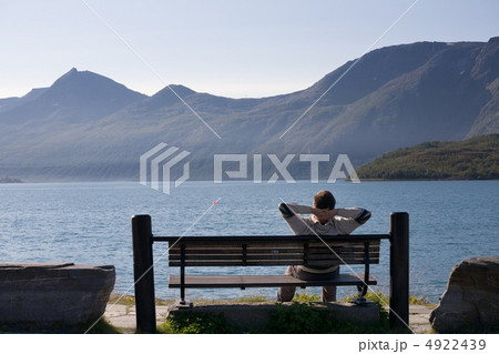 relaxed man on the bank of lake relaxed man on the bank of lake 4922439