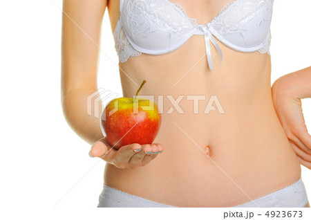 Female shapely a body and a red apple 4923673