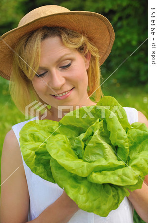 Young woman holding fresh lettuce 4934353