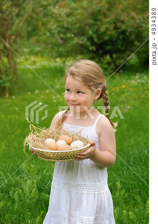 Little girl holding eggs 4934389
