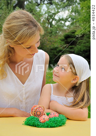 Young mother and daughter having Easter time 4934422