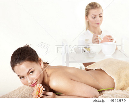 Young woman on massage table in beauty spa. 4941979