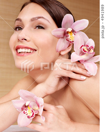 Young woman holding flower. Young woman holding flower. 4941989