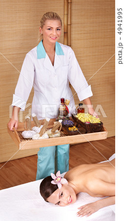 Young woman on massage table in beauty spa. 4941995