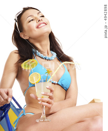Girl in bikini drink juice through  straw. 4942898