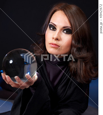 Young woman with crystal ball. Young woman with crystal ball. 4942972