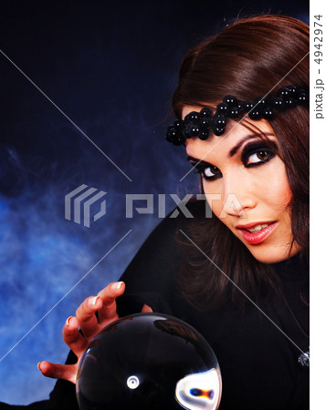 Young woman with crystal ball. 4942974